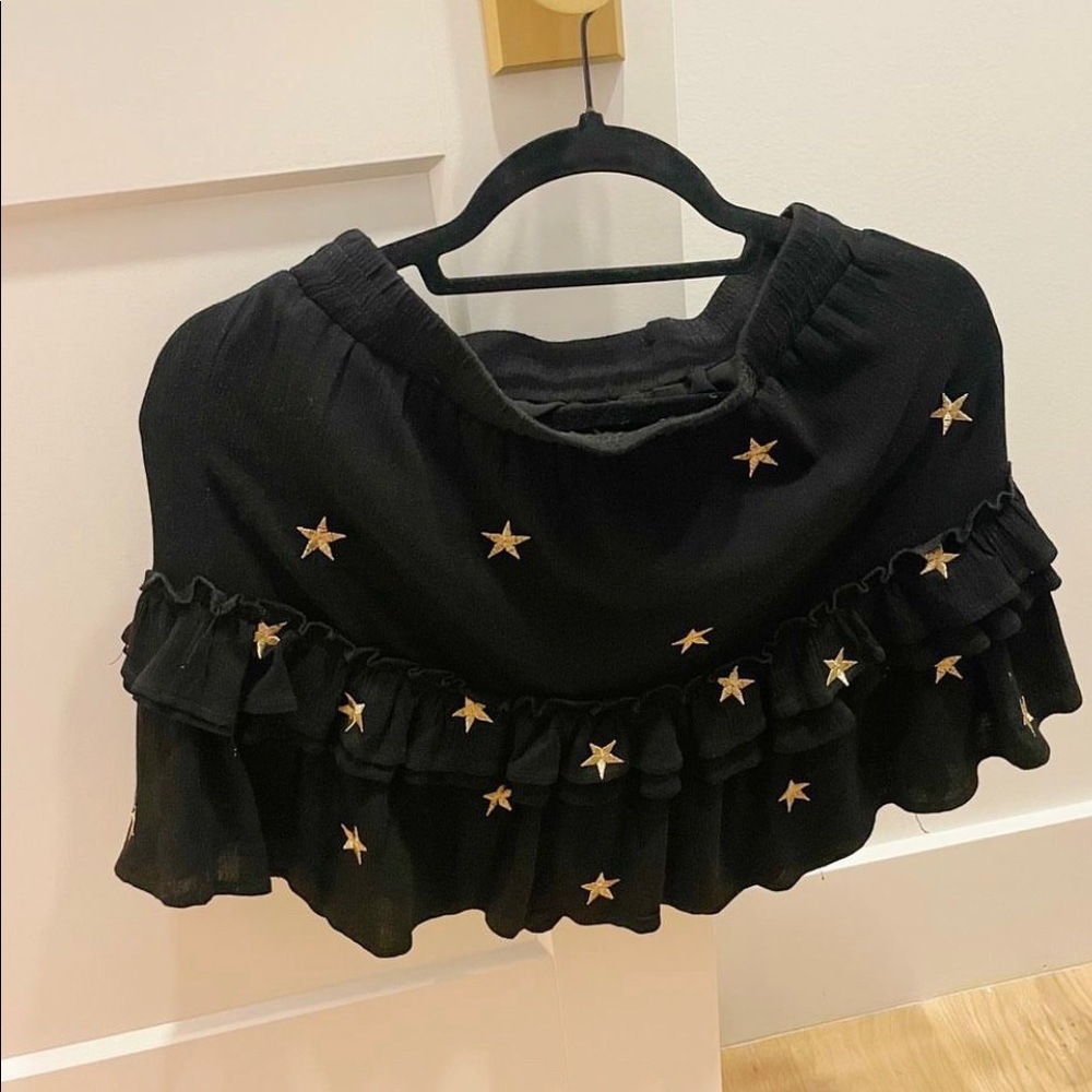 Impeccable pig black skirt with gold stars